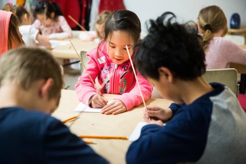 MIKAELA MACKENZIE / WINNIPEG FREE PRESS
Sofia Jung, six, pokes her drawing into styrofoam to to make ink prints at ARTcamp at the Winnipeg Art Gallery in Winnipeg on Wednesday, March 27, 2019. 
Winnipeg Free Press 2019.