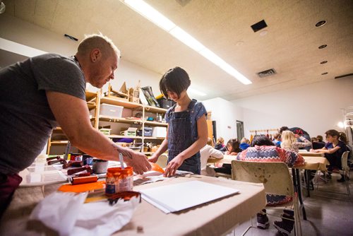 MIKAELA MACKENZIE / WINNIPEG FREE PRESS
Art instructor Michel St. Hilaire helps Greta Pancoe, eight, make ink prints at ARTcamp at the Winnipeg Art Gallery in Winnipeg on Wednesday, March 27, 2019. 
Winnipeg Free Press 2019.