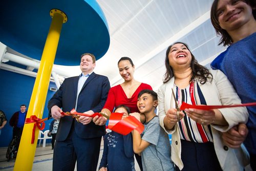 MIKAELA MACKENZIE / WINNIPEG FREE PRESS
MLA Nic Curry (left), councillor Vivian Santos and her kids, Summer and Easton, and councillor Devi Sharma cut the ribbon at the re-opening of updated Seven Oaks Pool and citys first indoor splash pad in Winnipeg on Thursday, March 28, 2019. 
Winnipeg Free Press 2019.