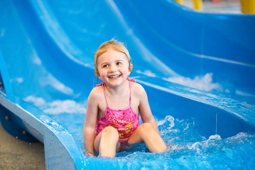 MIKAELA MACKENZIE / WINNIPEG FREE PRESS
Aidrie Low, four, goes down the slide at the citys first indoor splash pad at Seven Oaks Pool in Winnipeg on Thursday, March 28, 2019. 
Winnipeg Free Press 2019.