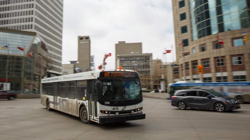 MIKE DEAL / WINNIPEG FREE PRESS
A Winnipeg Transit bus travels through the intersection of Portage Avenue and Main Street Thursday afternoon.
190328 - Thursday, March 28, 2019.