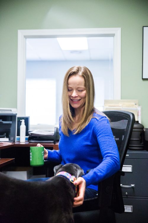 MIKAELA MACKENZIE / WINNIPEG FREE PRESS
Carrie Hasinoff, an owner of a Northern Sky dog, and her greyhound Stormy in her office at No-Spill Systems in Winnipeg on Friday, March 29, 2019.  For Declan Schroeder story.
Winnipeg Free Press 2019.