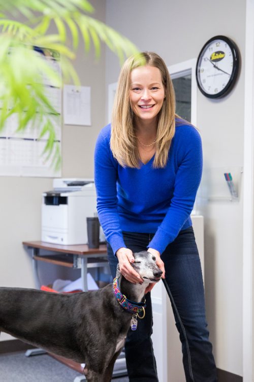 MIKAELA MACKENZIE / WINNIPEG FREE PRESS
Carrie Hasinoff, an owner of a Northern Sky dog, and her greyhound Stormy in her office at No-Spill Systems in Winnipeg on Friday, March 29, 2019.  For Declan Schroeder story.
Winnipeg Free Press 2019.