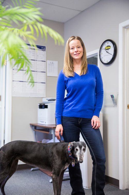 MIKAELA MACKENZIE / WINNIPEG FREE PRESS
Carrie Hasinoff, an owner of a Northern Sky dog, and her greyhound Stormy in her office at No-Spill Systems in Winnipeg on Friday, March 29, 2019.  For Declan Schroeder story.
Winnipeg Free Press 2019.