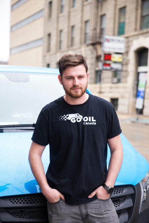 MIKAELA MACKENZIE / WINNIPEG FREE PRESS
John Sparrow, founder and CEO of GoOil, poses for a portrait with one of their vans in Winnipeg on Friday, March 29, 2019.  Go Oil is a a mobile oil-change company that has franchised 12 mobile oil-change trucks across Canada, and is looking to expand to the U.S. this year. For Ben Waldman story.
Winnipeg Free Press 2019.