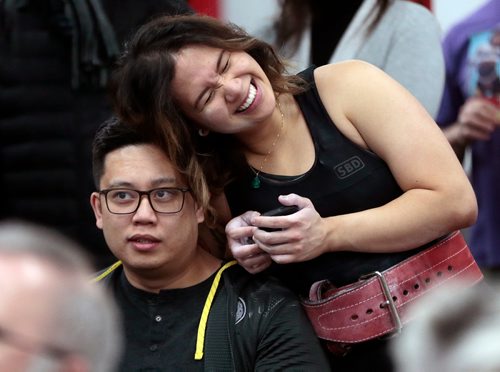 PHIL HOSSACK / WINNIPEG FREE PRESS - Jennifer Grace-Cruz shares a moment with her fiancee Carlo Calicia  after her deadlift Saturday. Lifters gathered at the Midtown Barbell Gym in Osborne Village to deadlift and raise funds for leukaemia patient Maya Chernican (4). See Bill Redekopp story / Press release. Call Andrew at 431-999-9437 for more details. - March 30, 2019.