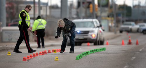 PHIL HOSSACK / WINNIPEG FREE PRESS -  City Police Investigators examine the scene of a Pick-Up truck / Pedestrian accident on McPhillips Street between Jarvis and Selkirk Saturday afternoon. No details were available at the scene. - March 30, 2019.