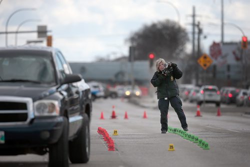 PHIL HOSSACK / WINNIPEG FREE PRESS -  City Police Investigators examine the scene of a Pick-Up truck / Pedestrian accident on McPhillips Street between Jarvis and Selkirk Saturday afternoon. No details were available at the scene. - March 30, 2019.