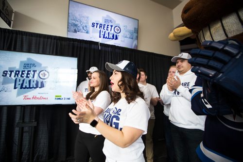 MIKAELA MACKENZIE / WINNIPEG FREE PRESS
Graziella Hicks cheers along with other fans from Economic Development Winnipeg and True North at the official launch of the 2019 #WPGWhiteout Street Parties at Bell MTS Place in Winnipeg on Monday, April 1, 2019.   For Ryan Thorpe story.
Winnipeg Free Press 2019.