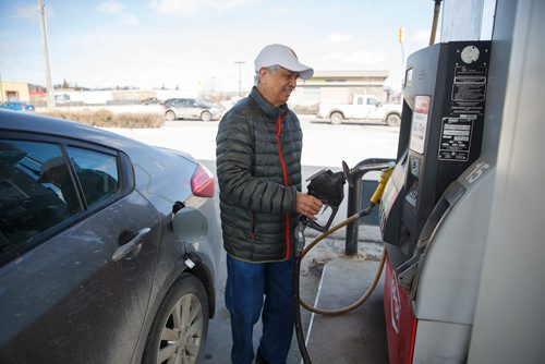MIKE DEAL / WINNIPEG FREE PRESS
Nick Generao filling up his four-door sedan at the Co-Op gas station at Ellice and Wall.
Talking to people at gas bars about the carbon tax, but not simply about whether they like paying more taxes. Are they in favour of this if it makes a difference in fighting climate change?  
190401 - Monday, April 01, 2019.