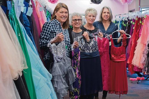 Canstar Community News March 29, 2019 - The Gowns for Grads Winnipeg organizing committee members Brooke Bouchard (left) Analyn Baker, Kim Michalski and Daniella McDonald are pictured with some of the party dresses available at the fundraising pop up sale on April 6. (DANIELLE DA SILVA/SOUWESTER/CANSTAR)