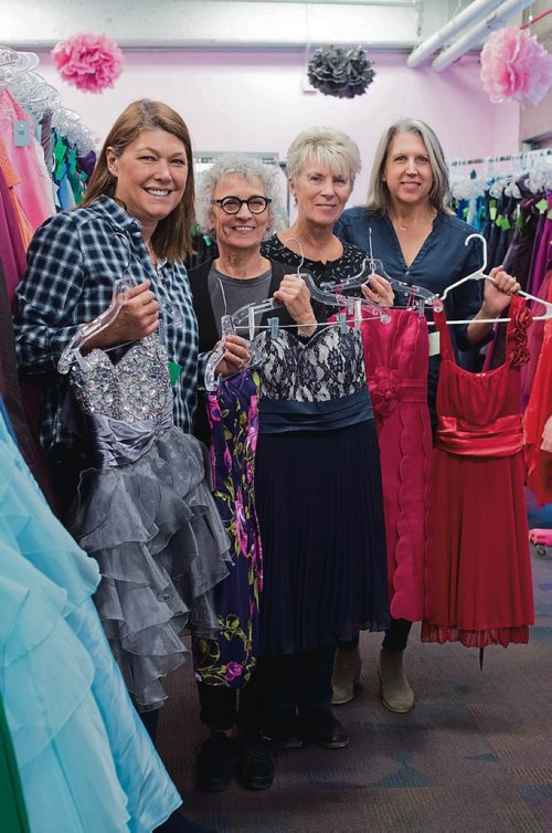 Canstar Community News March 29, 2019 - The Gowns for Grads Winnipeg organizing committee members Brooke Bouchard (left) Analyn Baker, Kim Michalski and Daniella McDonald are pictured with some of the party dresses available at the fundraising pop up sale on April 6. (DANIELLE DA SILVA/SOUWESTER/CANSTAR)