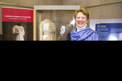 MIKAELA MACKENZIE / WINNIPEG FREE PRESS
Margaret Mills, board member of the Costume Museum, poses for a portrait with the Muriel Richardson dress on display in the Richardson Building in Winnipeg on Monday, April 1, 2019.  For Cassidy Dankochik story.
Winnipeg Free Press 2019.