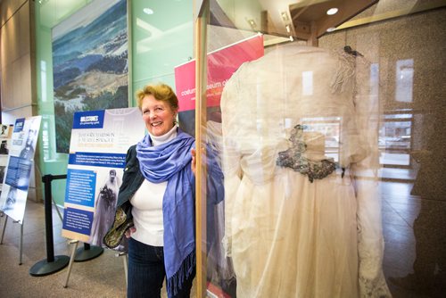 MIKAELA MACKENZIE / WINNIPEG FREE PRESS
Margaret Mills, board member of the Costume Museum, poses for a portrait with the Muriel Richardson dress on display in the Richardson Building in Winnipeg on Monday, April 1, 2019.  For Cassidy Dankochik story.
Winnipeg Free Press 2019.