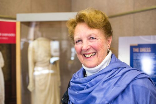 MIKAELA MACKENZIE / WINNIPEG FREE PRESS
Margaret Mills, board member of the Costume Museum, poses for a portrait with the Muriel Richardson dress on display in the Richardson Building in Winnipeg on Monday, April 1, 2019.  For Cassidy Dankochik story.
Winnipeg Free Press 2019.