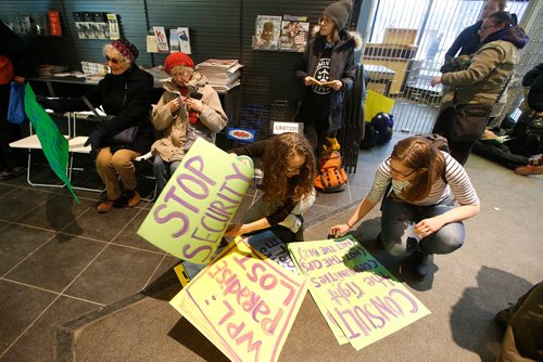 JOHN WOODS / WINNIPEG FREE PRESS
People take part in a sit-in protest at Millennium Library in Winnipeg Tuesday, April 2, 2019. About two hundred people gathered to protest the use of security checks to enter the library.