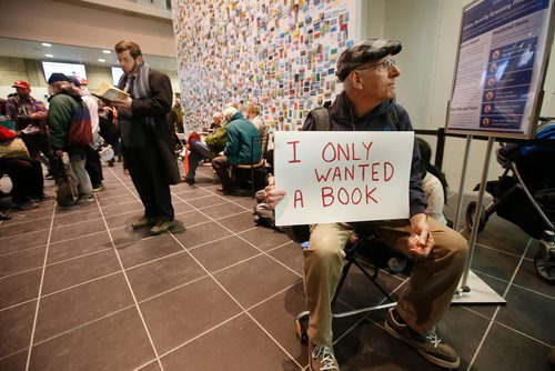 JOHN WOODS / WINNIPEG FREE PRESS
Russ Haggerty takes part in a sit-in protest at Millennium Library in Winnipeg Tuesday, April 2, 2019. About two hundred people gathered to protest the use of security checks to enter the library.