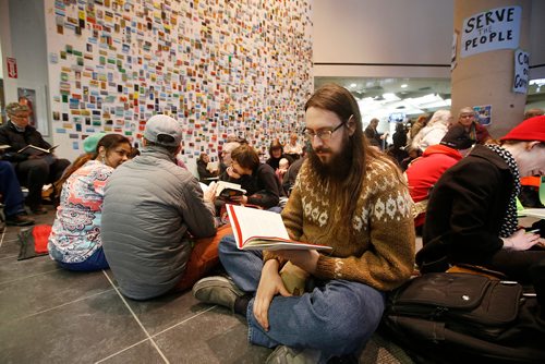 JOHN WOODS / WINNIPEG FREE PRESS
Eric Davies takes part in a sit-in protest at Millennium Library in Winnipeg Tuesday, April 2, 2019. About two hundred people gathered to protest the use of security checks to enter the library.