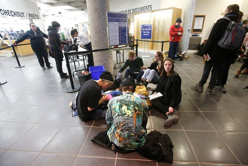 JOHN WOODS / WINNIPEG FREE PRESS
People take part in a sit-in protest at Millennium Library in Winnipeg Tuesday, April 2, 2019. About two hundred people gathered to protest the use of security checks to enter the library.