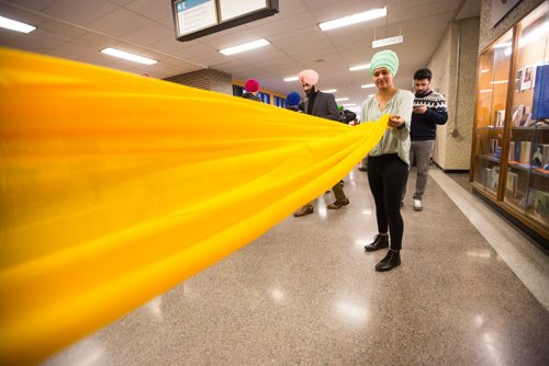 MIKAELA MACKENZIE / WINNIPEG FREE PRESS
Rashandeep Thind wraps fabric as Red River College students try on turbans for a cultural pride day at the college in Winnipeg on Wednesday, April 3, 2019.  For Alexandra Paul story.
Winnipeg Free Press 2019.