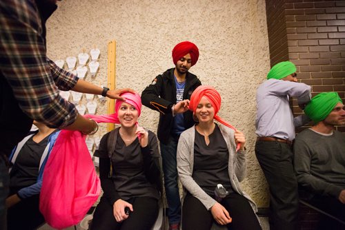 MIKAELA MACKENZIE / WINNIPEG FREE PRESS
Red River College students Taylor Kunderman (left), Emily Hollins, and William Gibson get turbans tied by Gurpreet Sidhu (centre) and Satnam Singh turbans for the first time at a cultural pride day at the college in Winnipeg on Wednesday, April 3, 2019.  For Alexandra Paul story.
Winnipeg Free Press 2019.