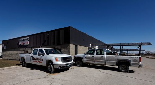 PHIL HOSSACK / WINNIPEG FREE PRESS  - Chateau Roofing and Siding equipment and trucks parked, Office closed. See Martin Cash story. - April 3, 2019.