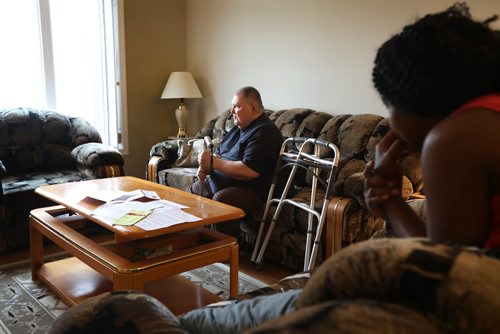 RUTH BONNEVILLE / WINNIPEG FREE PRESS 

Photos of Serge Bouchard, who is blind and uses a wheelchair, in his home at 803 Flora Ave. (with paperwork from the City of Winnipeg on the  coffee table in front of him), in his home on Thursday.  
His wife, Makhady Boucher-Camara, is in photo with him.  

Serge Bouchard who is blind and uses a wheelchair and is being hounded by city to have work done in his basement even though his 9-year-old house is targeted for demolition because its near Arlington Bridge.


See Carol Sanders story. 



April 4, 2019
