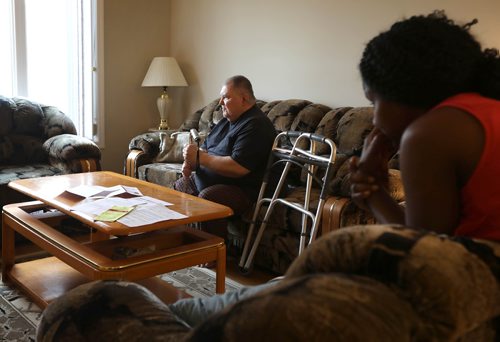 RUTH BONNEVILLE / WINNIPEG FREE PRESS 

Photos of Serge Bouchard, who is blind and uses a wheelchair, in his home at 803 Flora Ave. (with paperwork from the City of Winnipeg on the  coffee table in front of him), in his home on Thursday.  
His wife, Makhady Boucher-Camara, is in photo with him.  

Serge Bouchard who is blind and uses a wheelchair and is being hounded by city to have work done in his basement even though his 9-year-old house is targeted for demolition because its near Arlington Bridge.


See Carol Sanders story. 



April 4, 2019
