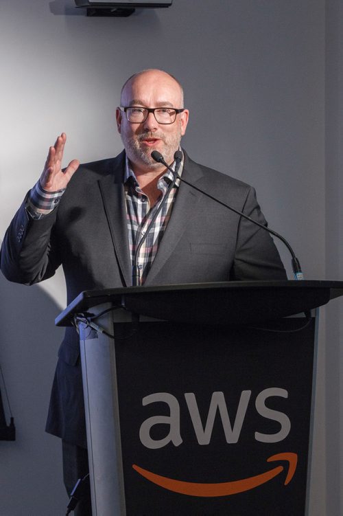 MIKE DEAL / WINNIPEG FREE PRESS
Chris Bond, Founder of AWS Thinkbox, speaks during the official opening of the AWS Thinkbox office on the fourth floor of the Johnston Terminal at The Forks, Friday morning.
Amazon Web Services, Inc. an Amazon.com company opened a new office in Winnipeg at The Forks in the Johnston Terminal. The office will be home to AWS Thinkbox, a development team that works on creative solutions for entertainment, design, architecture and engineering industries.
190405 - Friday, April 05, 2019.