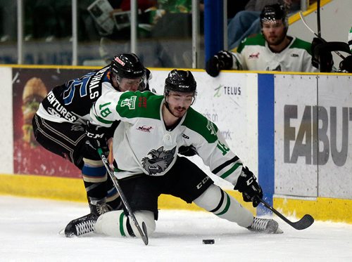 PHIL HOSSACK / WINNIPEG FREE PRESS - Portage Terrier #18 Kolton Shindle manages Swan Valley Stampeder #Bradley Goethals stick as he attempts to control the puck on his knees Friday night at Stride Place in Portage la Prairie. See Mike Sawatzsky story. -  April 5, 2019.