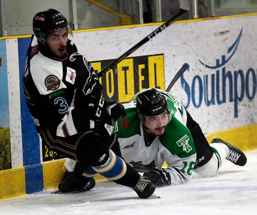 PHIL HOSSACK / WINNIPEG FREE PRESS - Portage Terrier #18 looks up as he takes down Swan Valley Stampeder #3 John Jabamani in a collision Friday night at Stride Place in Portage la Prairie. See Mike Sawatzsky story. -  April 5, 2019.