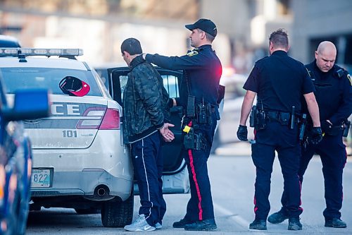 MIKAELA MACKENZIE / WINNIPEG FREE PRESS
Police put a man in a cruiser investigating an incident at the Windsor Hotel in Winnipeg on Saturday, April 6, 2019.
Winnipeg Free Press 2019.