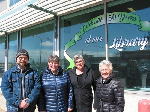 Canstar Community News April 2, 2019 - (From left) Portage la Prairie Regional Library's head librarian Richard Bee stands with library anniversary committee members Patricia Brown, Pat Calder and Dorothy Morrish outside the library at 40 Royal Road NE. (ANDREA GEARY/CANSTAR COMMUNITY NEWS)