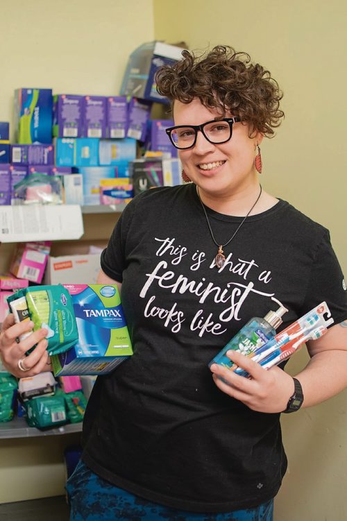 Canstar Community News April 2, 2019 - West Central Women's Resource Centre drop-in co-ordinator Merrill Grant holds a few hygiene products the centre gives out to women each week. The WCWRC is hosting its annual hygiene product donation drive until the end of April.  (EVA WASNEY/CANSTAR COMMUNITY NEWS/METRO)