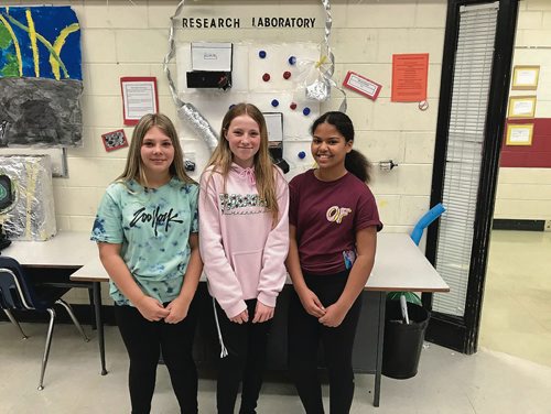Canstar Community News Grade 6 students Kaitlyn Leclerc, Kali Chiborak, and Amielia Wenzel researched and built a model of the International Space Station's research station during science class. (SHELDON BIRNIE/CANSTAR/THE HERALD)