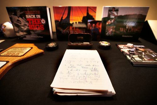 JOHN WOODS / WINNIPEG FREE PRESS
A notebook of handwritten notes sits in front of Randy Taylors books at a Celebration of Life for the Winnipeg Free Press writer in the Burton Cummings Theatre in Winnipeg Monday, April 8, 2019.

Reporter: Alex