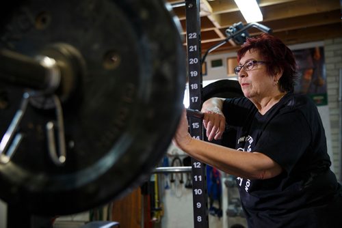 MIKE DEAL / WINNIPEG FREE PRESS
Susan Haywood a record-breaking 70-year-old power lifter works out in her home gym near Teulon, Manitoba.
190403 - Wednesday, April 03, 2019.