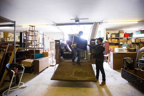MIKAELA MACKENZIE / WINNIPEG FREE PRESS
Volunteers Solomon Temesgen (left) and Hadish Tarefe load up the trailer at the Hands of Hope, an organization that gives away basic household goods and furniture to families, in the North End of Winnipeg on Tuesday, April 9, 2019. 
Winnipeg Free Press 2019.