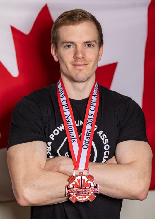 SASHA SEFTER / WINNIPEG FREE PRESS
Powerlifter Ryan Kolesar poses for a photo with his 2019 Canadian Powerlifting Union bronze medal inside of his Winnipeg home.
190410 - Wednesday, April 10, 2019.