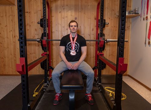 SASHA SEFTER / WINNIPEG FREE PRESS
Powerlifter Ryan Kolesar poses for a photo with his 2019 Canadian Powerlifting Union bronze medal inside of his Winnipeg home.
190410 - Wednesday, April 10, 2019.