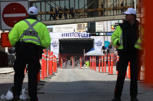 RUTH BONNEVILLE / WINNIPEG FREE PRESS 

Winnipeg Police Officers keep traffic from going northbound Smith Street. from St. Mary Ave. as crews prep area with screens and speakers for Whiteout party on Wednesday.



April 10, 2019