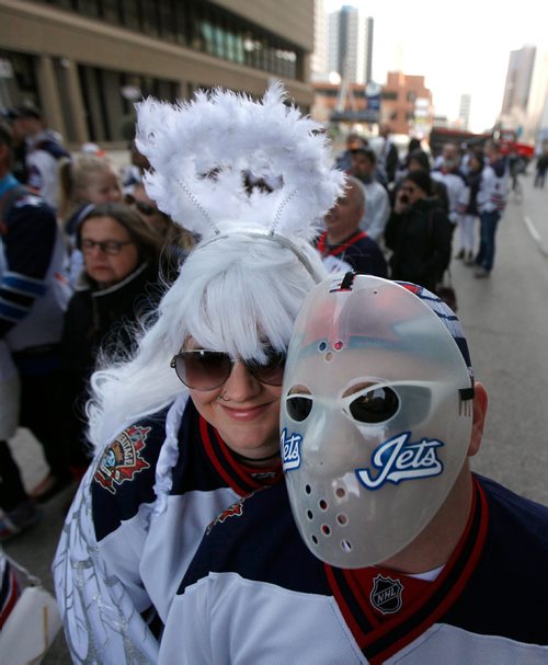 PHIL HOSSACK / WINNIPEG FREE PRESS -  Shawn and Laura Aseltine got all dressed up for the'Ball' aka Jets whiteout street party on Donald Street venue Wednesday. See story. - April 10, 2019.