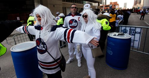 PHIL HOSSACK / WINNIPEG FREE PRESS - Jets Street Party fans line up to be searched on their way into the Donald Street venue Wednesday. See story. - April 10, 2019.