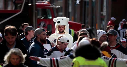 PHIL HOSSACK / WINNIPEG FREE PRESS -   Jordan Melnyk stands head and shoulders above everyone else in the lineup in front of him waiting to get into the Jets whiteout street party on Donald Street venue Wednesday. See story. - April 10, 2019.