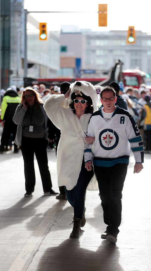 PHIL HOSSACK / WINNIPEG FREE PRESS -   Charlene and Eddie Turcottte clear the lineup to get into the Jets whiteout street party on Donald Street venue Wednesday. See story. - April 10, 2019.