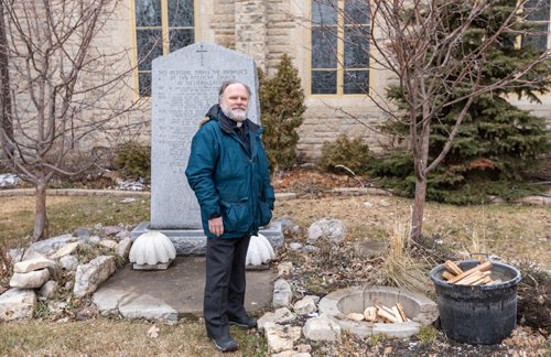 SASHA SEFTER / WINNIPEG FREE PRESS
FAITH - Reverend Paul Johnson of St. John's Cathedral sets up wood in a stone circle in preparation for the upcoming Easter fire.
190412 - Friday, April 12, 2019.