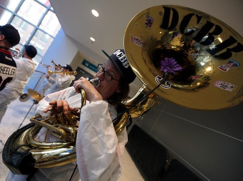 PHIL HOSSACK / WINNIPEG FREE PRESS - WHITE OUT PARTY-  Brass Band tuba player keeps time for fans as they transit from the party to the game Friday. See Alex Paul's story. - April 12, 2019.
