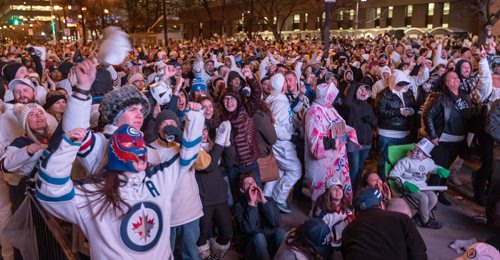 SASHA SEFTER / WINNIPEG FREE PRESS
Winnipeg Jets fans celebrate after Blake Wheeler nets a first period goal to tie the game 1-1 during last nights Whiteout street party. 
190412 - Friday, April 12, 2019.