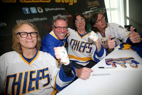 TREVOR HAGAN / WINNIPEG FREE PRESSDarrell Chudy, second from left, poses with the Hanson Brothers, from left, Dave Hanson, Steve Carlson, and Jeff Carlson, from Slapshot, during World of Wheels, at the convention centre, Saturday, April 13, 2019.