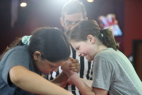 TREVOR HAGAN / WINNIPEG FREE PRESS
Reagan Meeches, left, versus Jordan Espey for the age 9-10 left arm bracket winner at the Manitoba Provincial Arm Wrestling Championships at Canad Inns Polo Park, Saturday, April 13, 2019. Jordan would go on to win the category in front of referee Ward Drake.